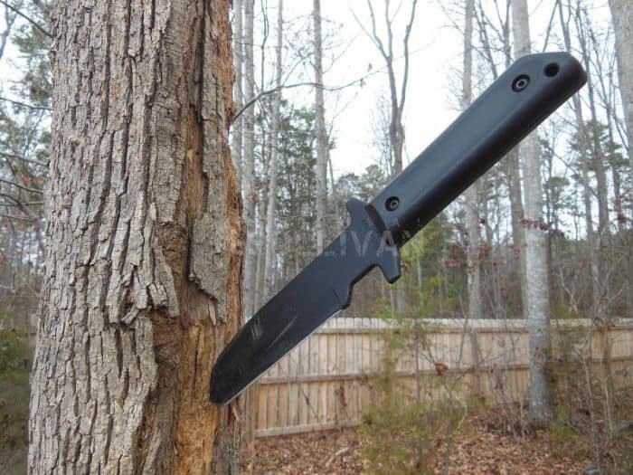 large knife stuck in tree